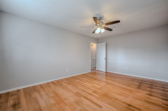 empty room featuring ceiling fan and light wood-type flooring