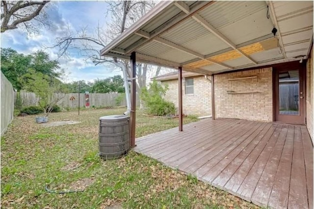 wooden deck with a yard