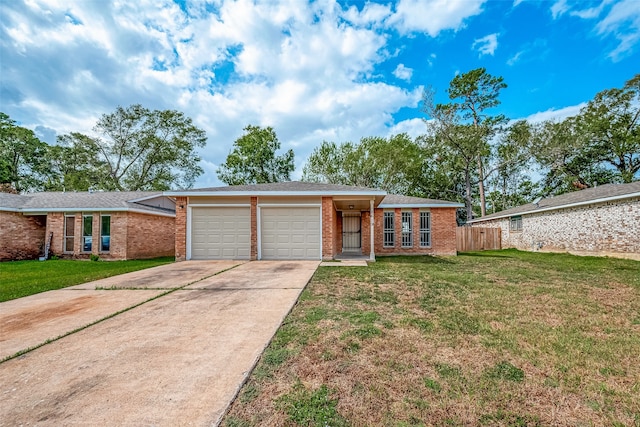 single story home featuring a front lawn and a garage