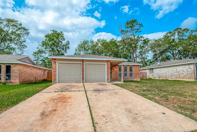 single story home featuring a garage and a front yard