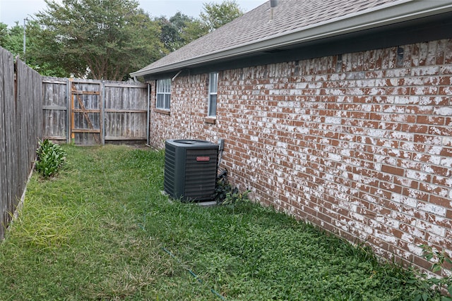 view of yard with central AC unit