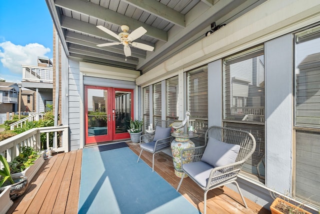 deck with french doors and ceiling fan