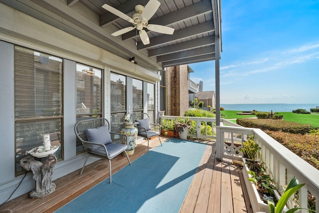 exterior space featuring ceiling fan, beamed ceiling, a water view, and wooden ceiling