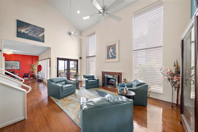 living room with hardwood / wood-style flooring, ceiling fan, and a healthy amount of sunlight