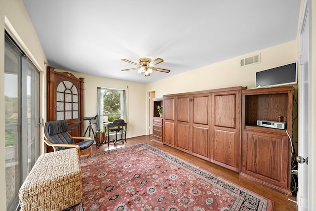 sitting room featuring ceiling fan and light wood-type flooring