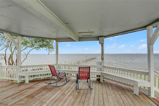 wooden deck with a water view