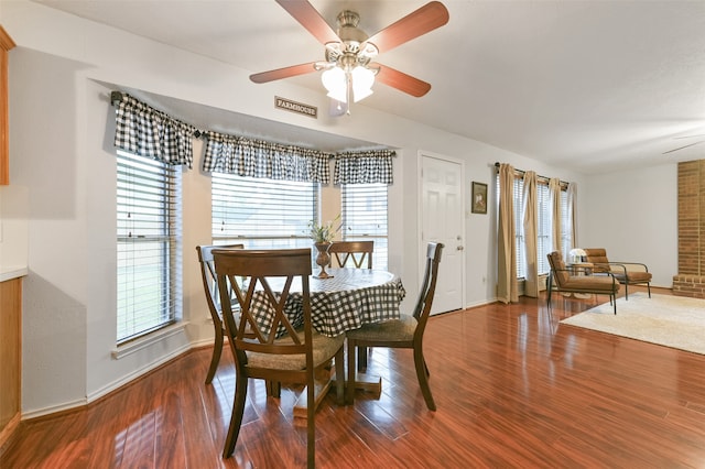 dining area with ceiling fan and dark hardwood / wood-style floors