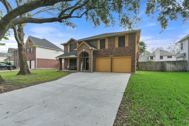 view of front of house featuring a garage and a front yard