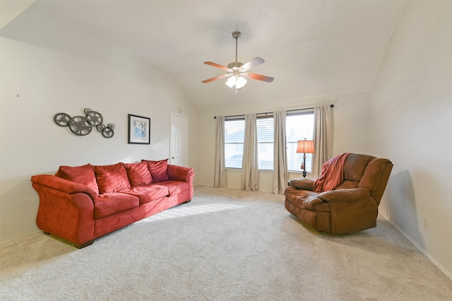 carpeted living room featuring ceiling fan and lofted ceiling