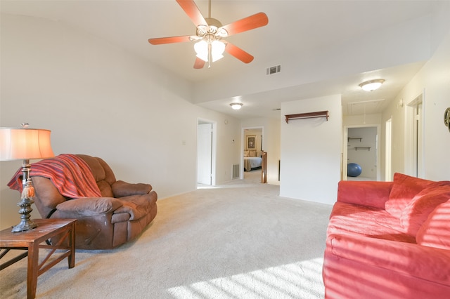 living room featuring ceiling fan and light carpet