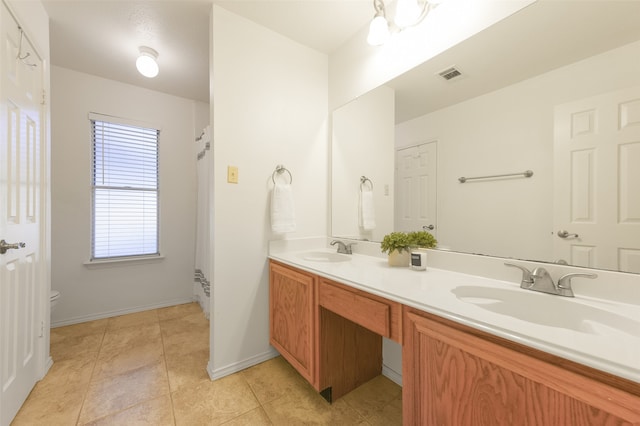 bathroom featuring tile patterned floors, vanity, and toilet