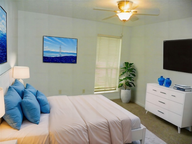 bedroom with ceiling fan and carpet