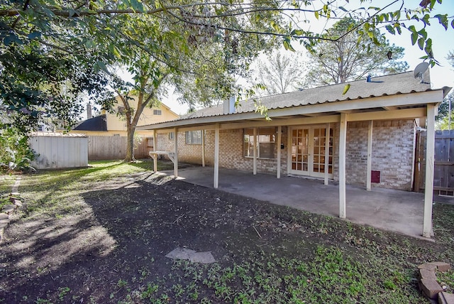 back of house featuring a patio area and french doors