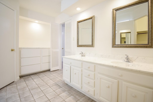 bathroom with tile patterned flooring and vanity