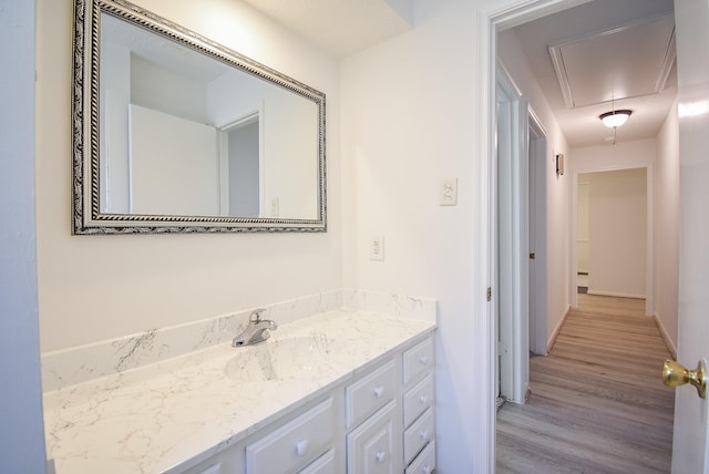 bathroom featuring wood-type flooring and vanity