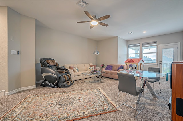 living room with carpet flooring and ceiling fan