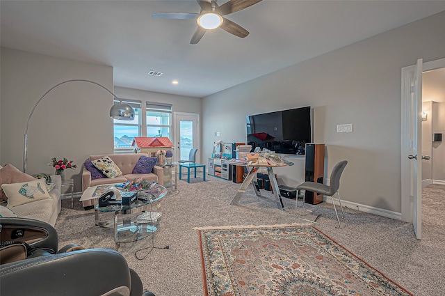 living room featuring ceiling fan and carpet floors