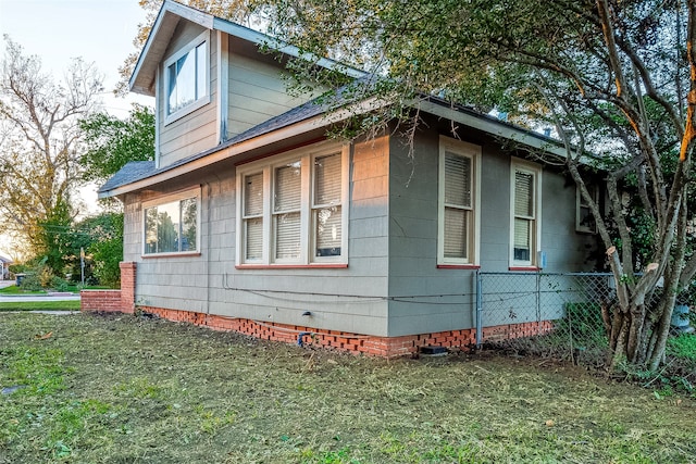 view of home's exterior featuring a yard