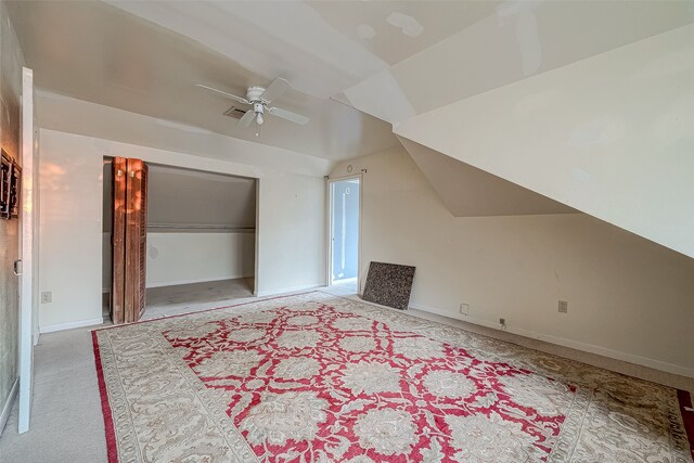 bonus room featuring ceiling fan, light colored carpet, and vaulted ceiling