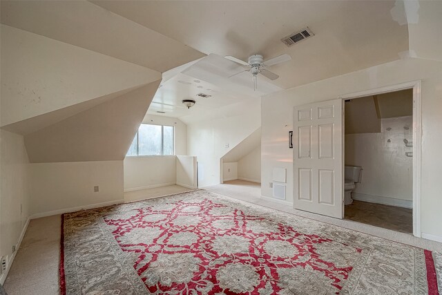 bonus room with ceiling fan, light colored carpet, and vaulted ceiling