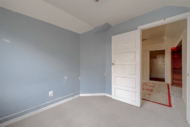 unfurnished room with carpet floors