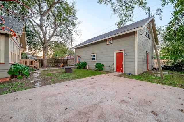 rear view of property featuring a patio area