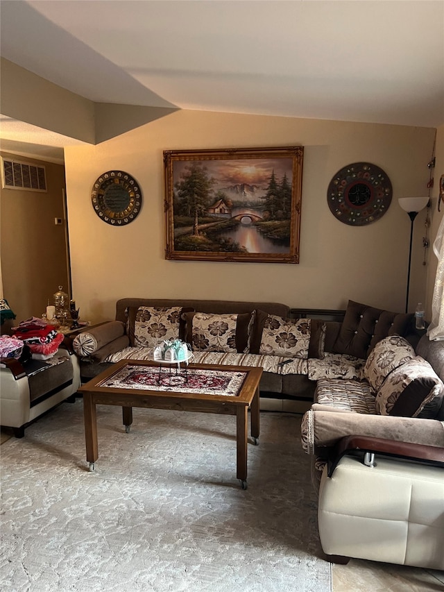 living room with carpet flooring and lofted ceiling