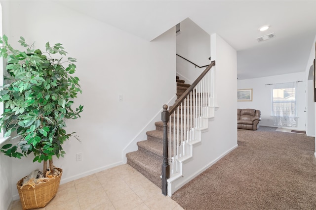 stairway with carpet flooring