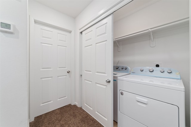 laundry room featuring independent washer and dryer and dark carpet