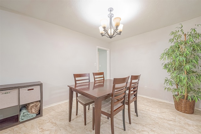 dining room with a notable chandelier