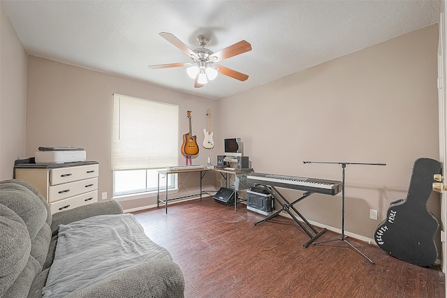 office space with dark wood-type flooring, ceiling fan, and a textured ceiling