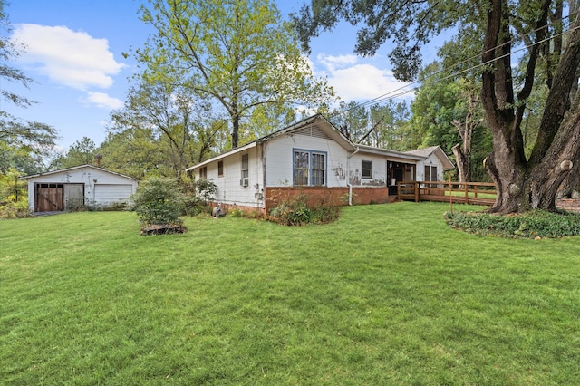 exterior space featuring a front lawn and a wooden deck