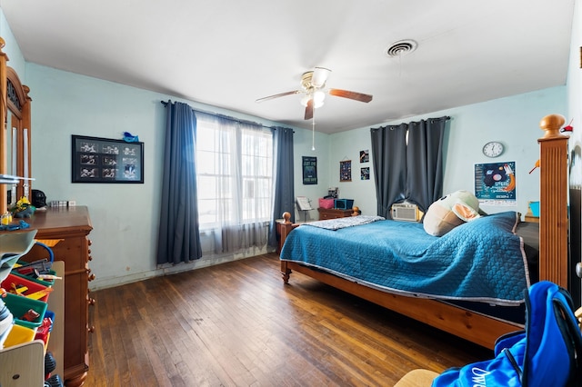 bedroom with dark wood-type flooring and ceiling fan