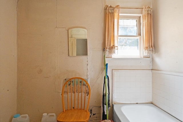 bathroom featuring a tub