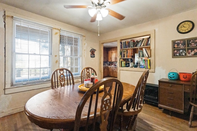 dining room with hardwood / wood-style floors and ceiling fan