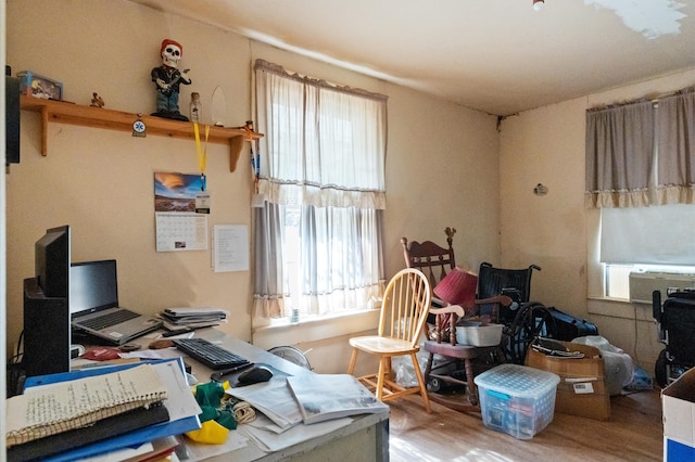 office space with cooling unit and wood-type flooring