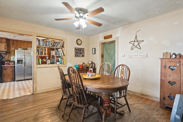 dining area featuring hardwood / wood-style flooring and ceiling fan