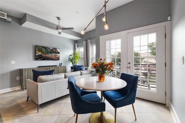 dining area featuring light tile patterned flooring, ceiling fan, and vaulted ceiling