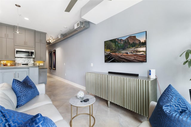 1011 Studemont St Unit 101, Houston, TX 77007 - living room featuring baseboards, light tile patterned flooring, ceiling fan, and recessed lighting