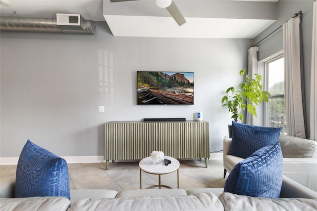1011 Studemont St Unit 101, Houston, TX 77007 - living room featuring ceiling fan, baseboards, and tile patterned flooring