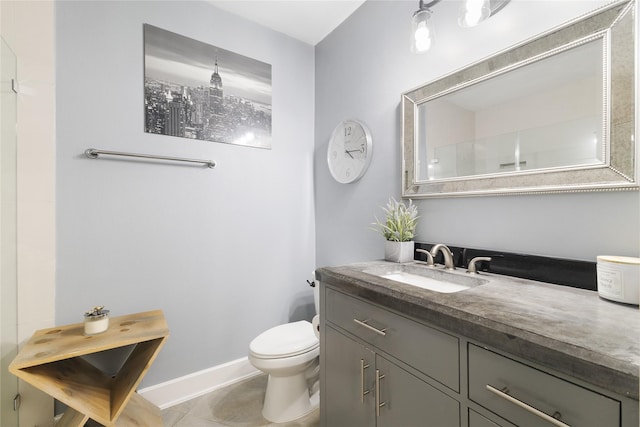 1011 Studemont St Unit 101, Houston, TX 77007 - bathroom featuring toilet, vanity, baseboards, and tile patterned floors