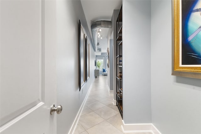 1011 Studemont St Unit 101, Houston, TX 77007 - hall featuring light tile patterned floors and baseboards