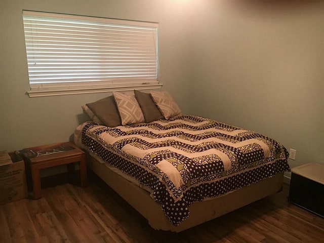 bedroom featuring dark hardwood / wood-style floors