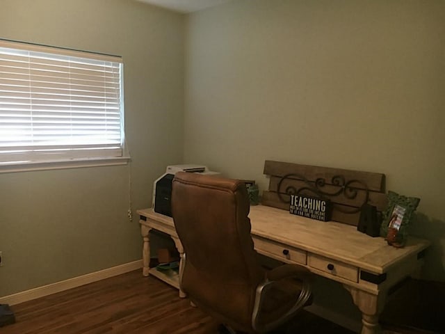 office space with dark wood-type flooring