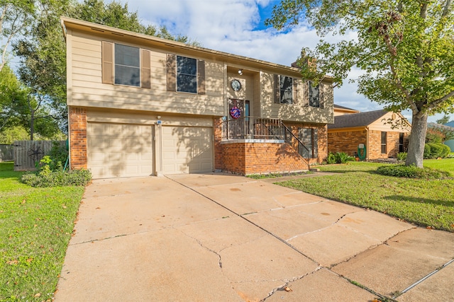 bi-level home featuring a front yard and a garage