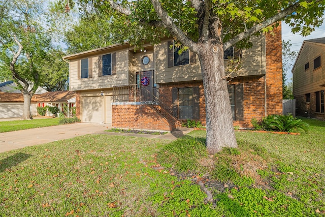 bi-level home featuring a garage and a front yard