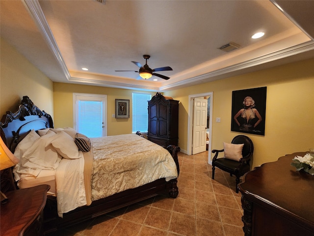 bedroom with a tray ceiling, tile patterned flooring, ceiling fan, and crown molding