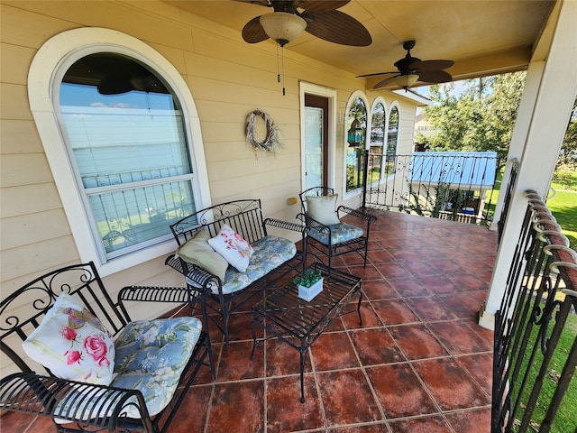 view of patio with a porch and ceiling fan