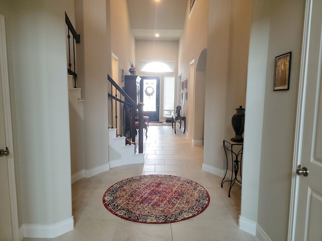 corridor featuring light tile patterned flooring