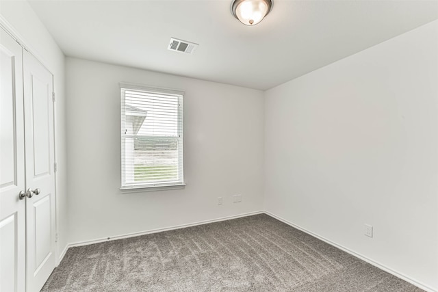 empty room featuring carpet flooring